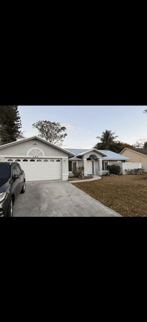 South Florida home before its gray exterior and blue-door painting project