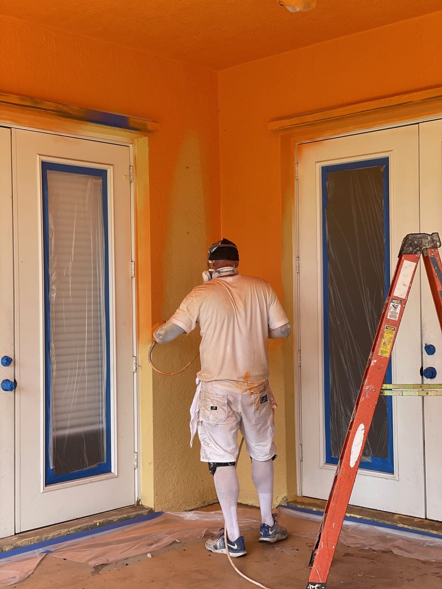 Twils spray-painting during a real South Florida project